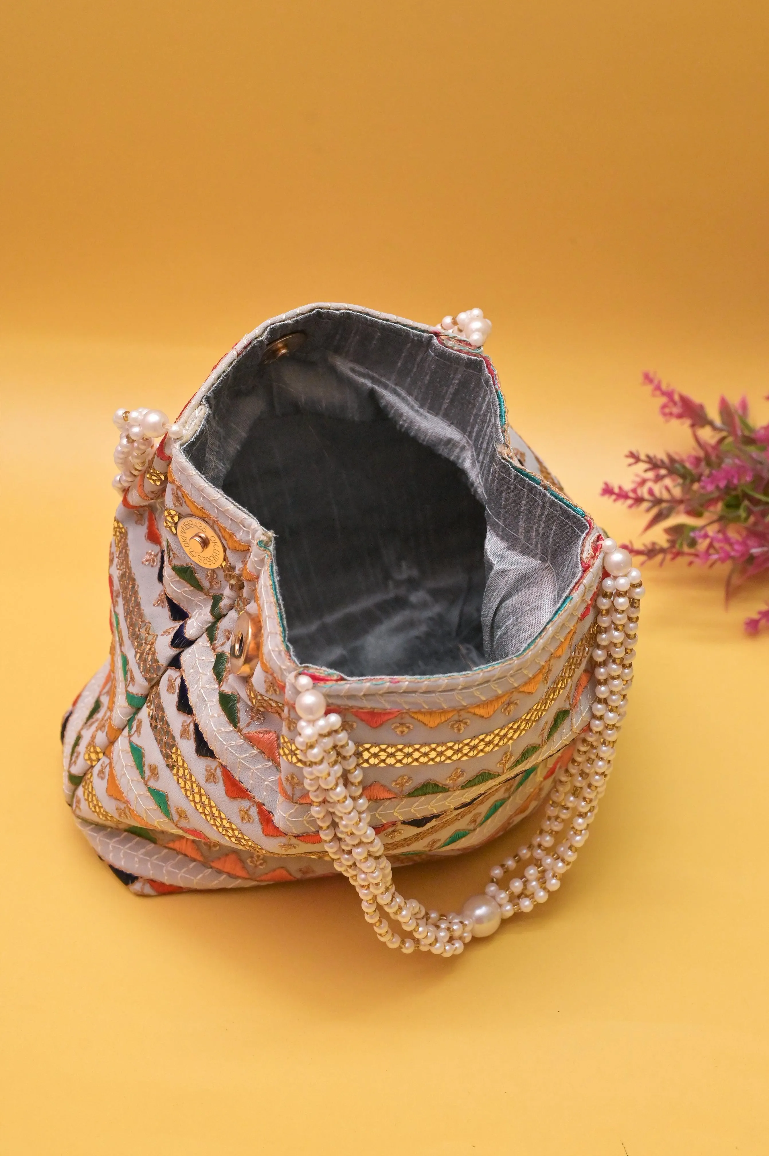 Ash Color Potli Clutch with Embroidery and Pearl Handle