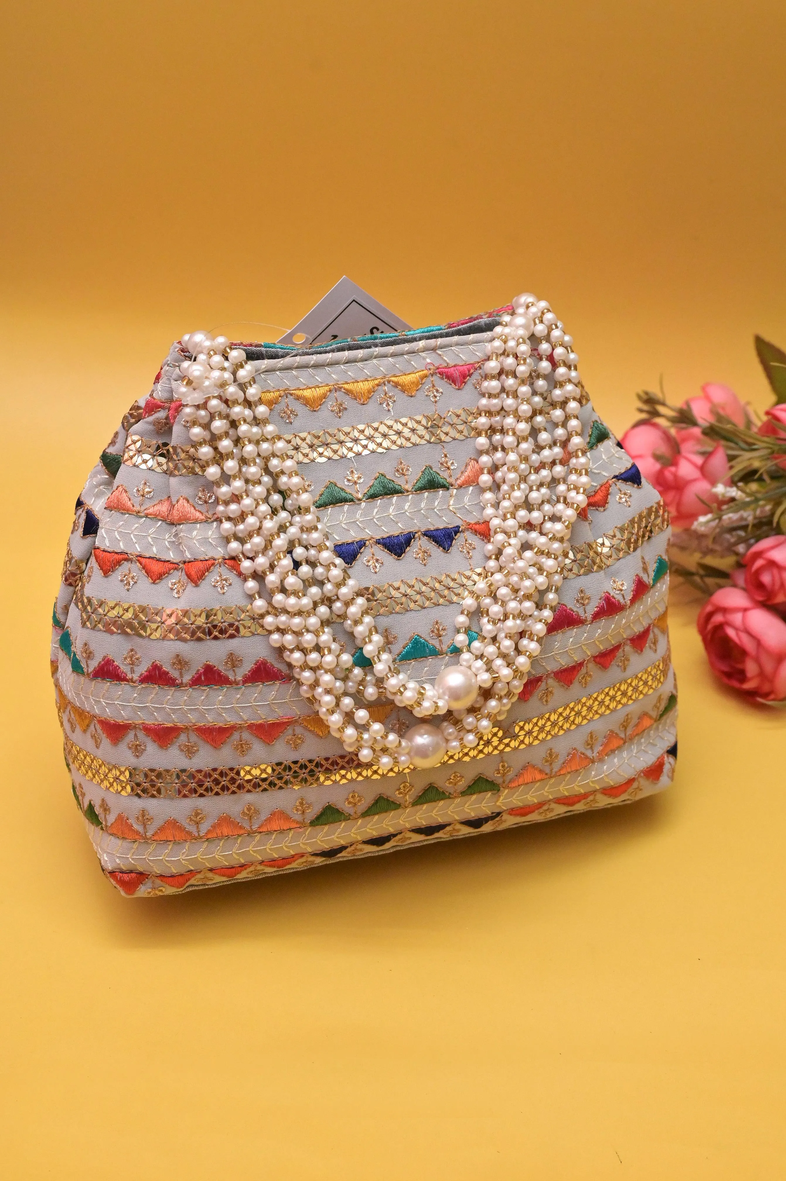 Ash Color Potli Clutch with Embroidery and Pearl Handle